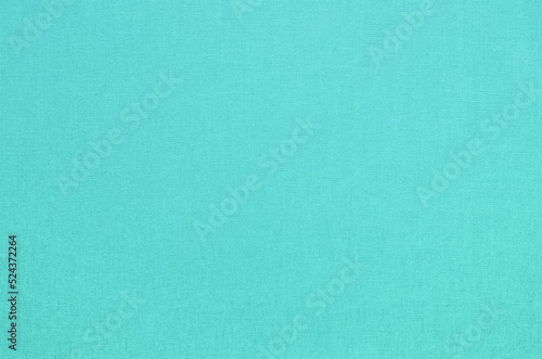 Close-up texture of natural weave cloth. Turquoise blue fabric background. Natural cotton textile material.