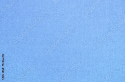 Close-up texture of natural weave cloth. Zenith blue fabric background. Natural cotton textile material.