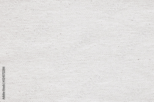 Close-up texture of natural weave cloth. White fabric background. Natural linen or cotton textile material.