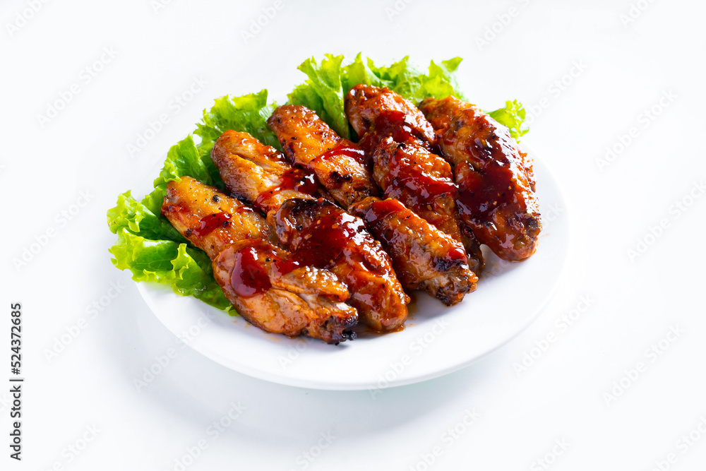 Stir fried chicken fillet with sauce in a white plate on white background, Thai food, isolated on white, isolated