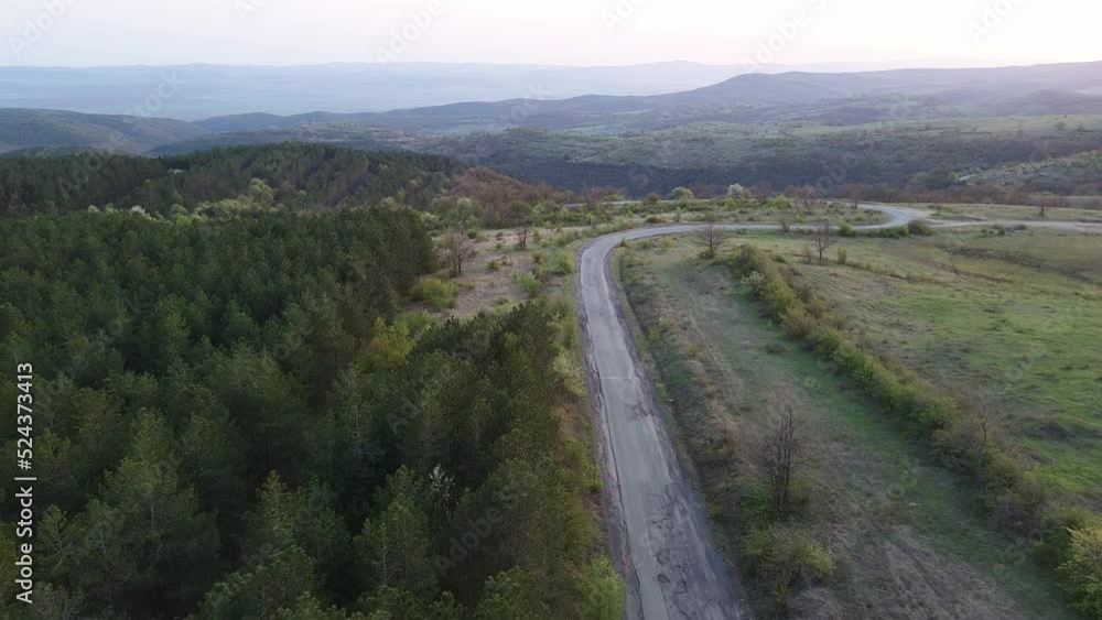 A view from a height of the meadows and slopes of the Balkan Mountains under daylight in Bulgaria A view from a height of the meadows and slopes of the Balkan Mountains under daylight in Bulgaria