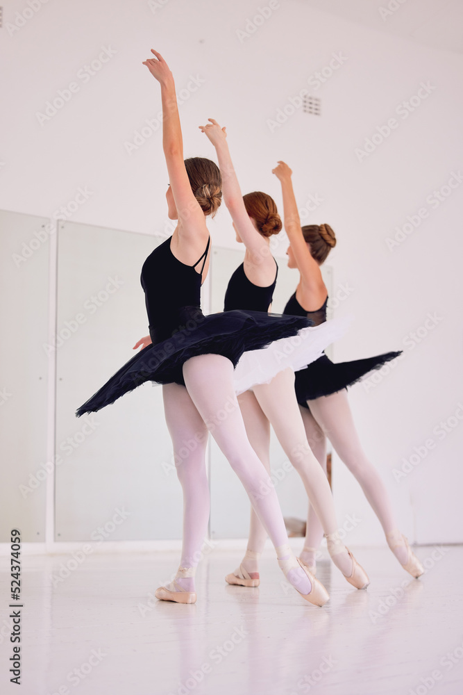 Ballet dancers dancing and practicing in a dance studio together preparing for a performance. Group of elegant, skilled and talented ballerinas moving in sync and learning in a class or club Ballet dancers dancing and practicing in a dance studio together preparing for a performance. Group of elegant, skilled and talented ballerinas moving in sync and learning in a class or club
