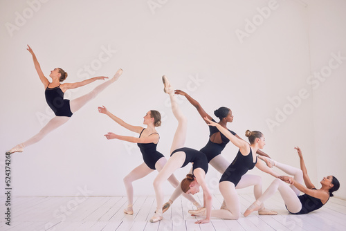 Group of contemporary or ballet dancers performing a unique sequence in a studio. Team of modern elegant ballerinas dancing or practicing for performance and creating entertainment art