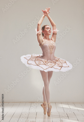 Leinwand Poster Female ballerina doing ballet dance, dancing or performing during a practice rehearsal in studio