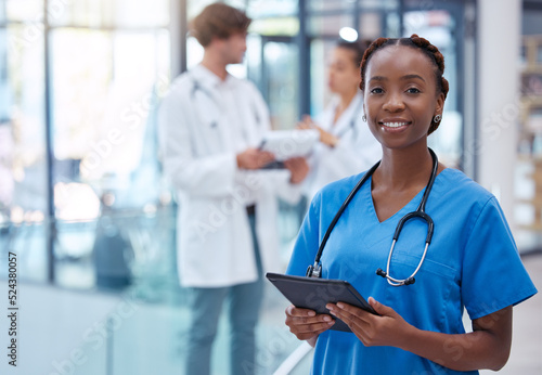 Nurse, professional and healthcare worker with tablet in medical center, clinic and hospital while analyzing test result. Portrait of frontline worker showing trust, care and knowledge about medicine photo