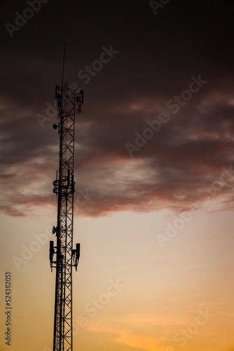 Telecommunications antenna during sunset. Cellular technology.