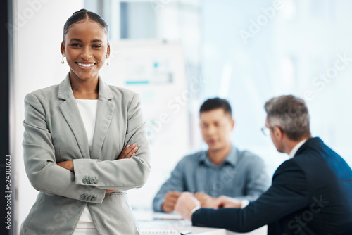 Assistant, intern andor training business woman looking proud, confident and motivated before a boardroom team meeting. Portrait of powerful, ambitious and inspired office corporate with arms crossed