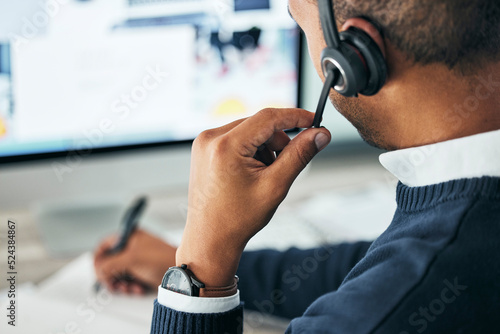 Fotografie Call center, customer service and agent assisting online customer with a headset and taking notes