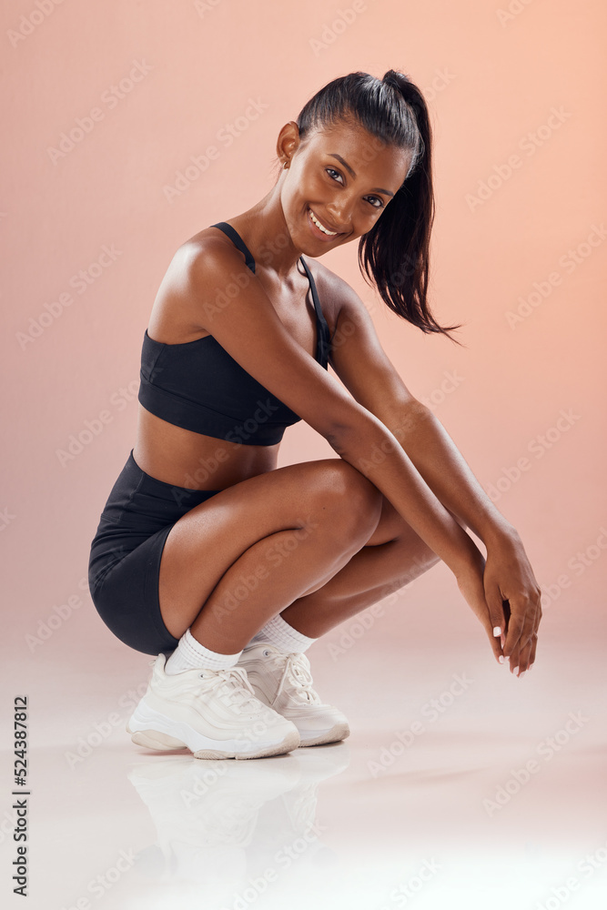 Stylish, fit and trendy female athlete model in sportswear against pink  studio background. Portrait of an athletic and cute African American young  woman relaxing with a sports style or fashion Stock Photo