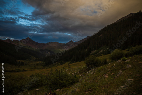 Alpine meadow at twilight with overcast glow