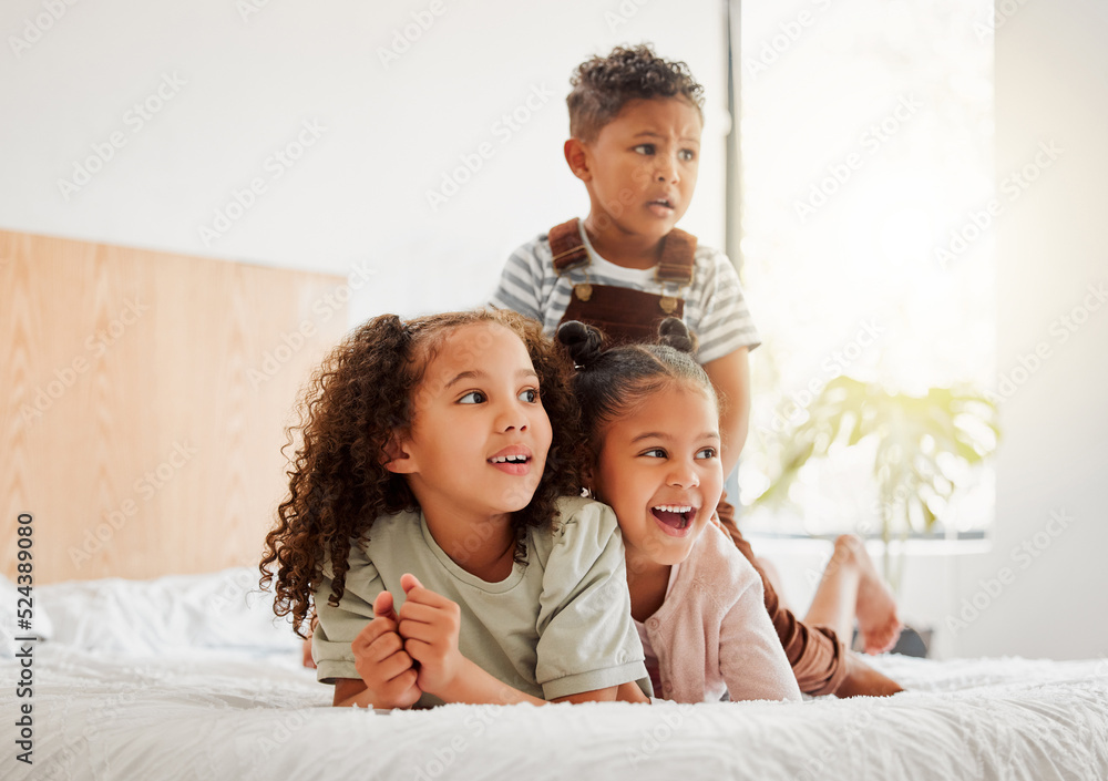 Happy children or siblings relaxing, playing and enjoying the house, growth and freedom. Kids, bedroom and facial expressions while watching entertainment shows on the bed together at home. Happy children or siblings relaxing, playing and enjoying the house, growth and freedom. Kids, bedroom and facial expressions while watching entertainment shows on the bed together at home.