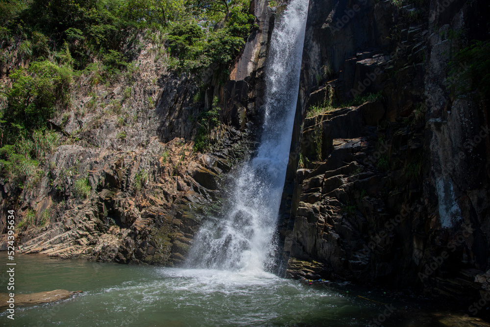 Fototapeta premium 2022 Aug 10,Hong Kong.Waterfall Bay in Pok Fu Lam, Hong Kong Island, Hong Kong.One of the Waterfall close to the city.
