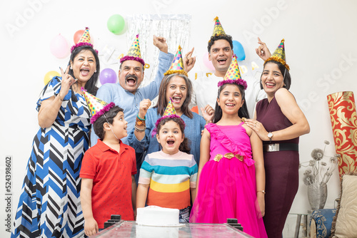 Photography Cheerful indian asian generational family celebrate indoor birthday party