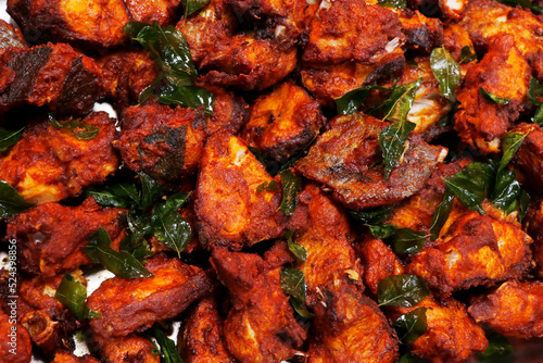 kerala style masala marinated fried fish in close up