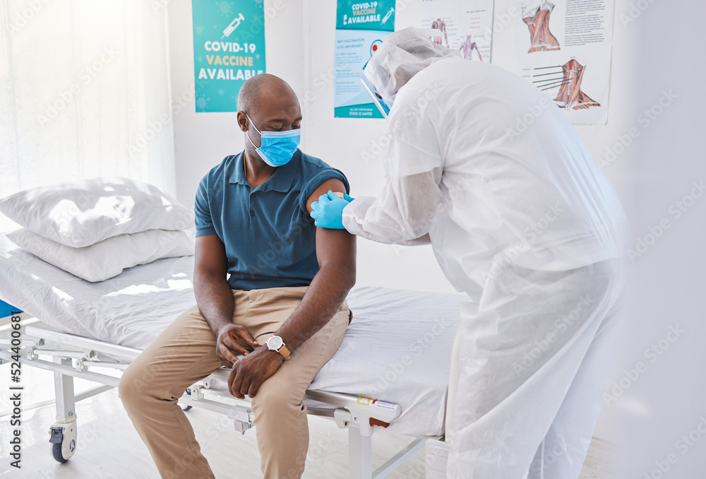 Obraz premium Patient getting covid vaccine, injection and cure from a doctor in a clinic. Man with plaster bandage on arm after flu jab, antiviral shot and health treatment to boost immunity and prevent illness