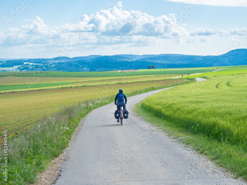 Black forest, Germany - May 29th 2022: A cyclist in the open landscape of Schwarzwald.