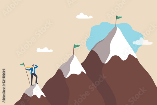 Ambition to success and achieve target, career growth or business goals, challenge to win, achievement or victory concept, motivated businessman reach mountain peak aiming to achieve higher targets.