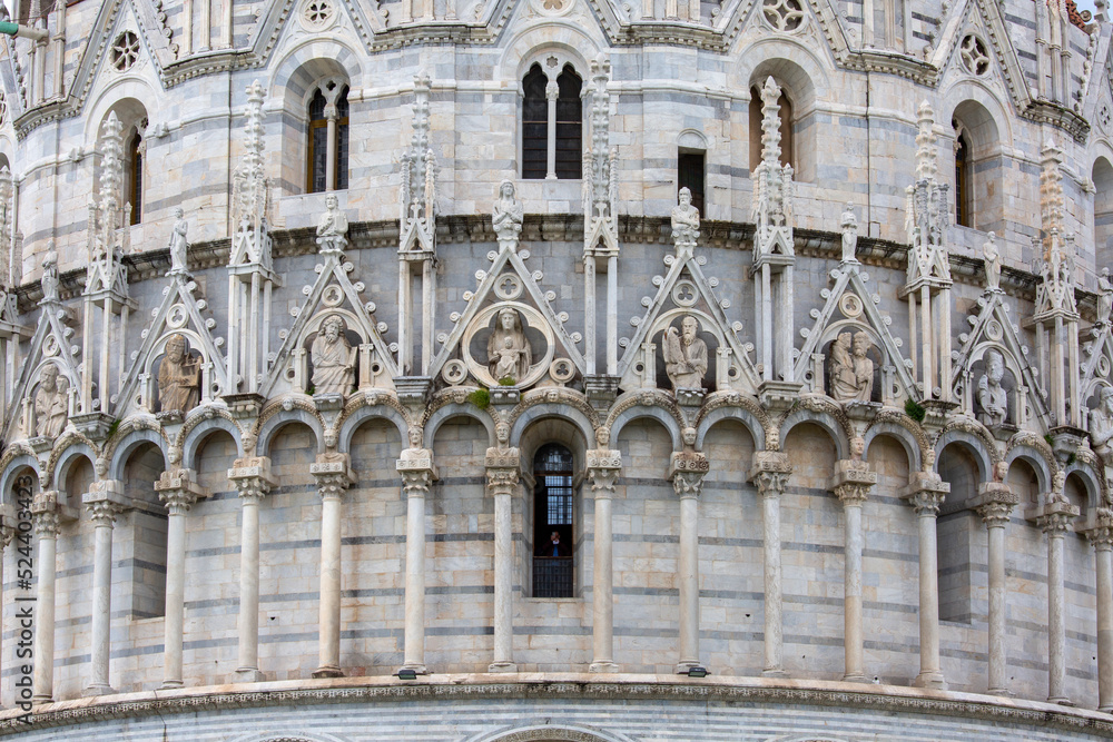 Decorative facade of Pisa Baptistery of St. John on Piazza del Duomo, Pisa, Italy.