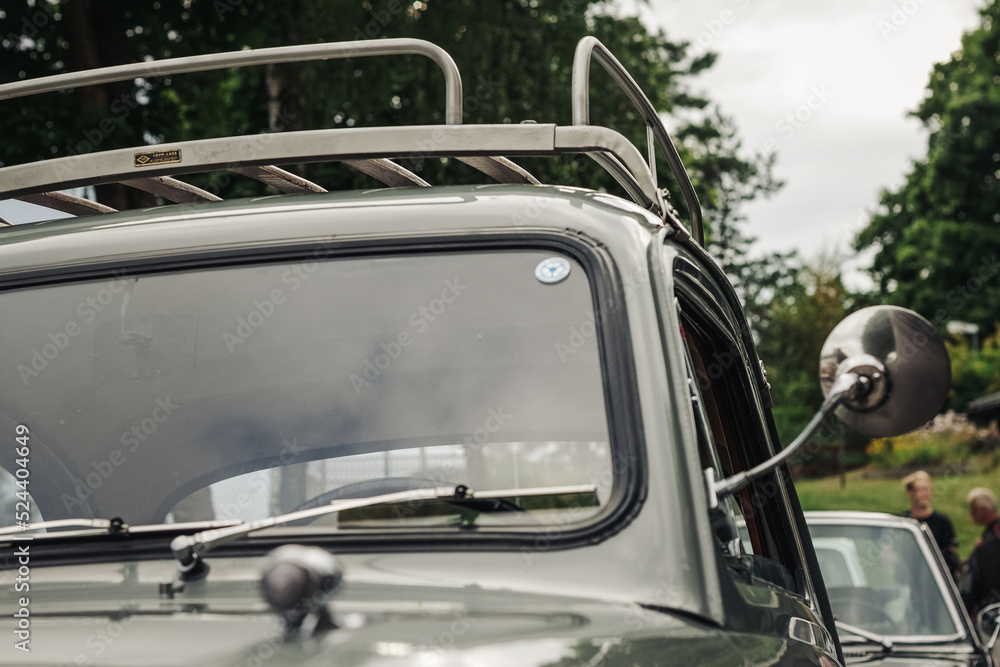 Vintage car with side mirror and luggage rack