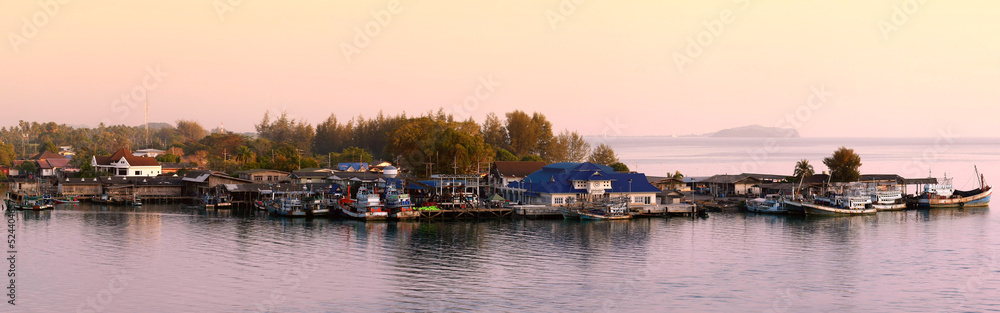 Sun set over fisherman's village in Thailand.