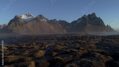 Austurland, Iceland - July 19, 2019: Drone view, Scenic aerial view of Black sand beach and Vesturhorn mountain in Iceland