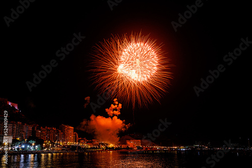  fireworks show at night on the shores of the sea of Alicante Spain