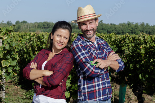 happy couple in vineyard before harvesting