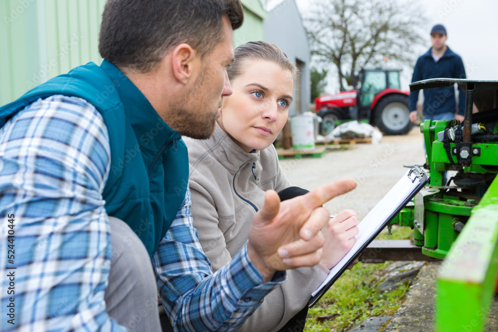 agricultural equipment workers having a conversation agricultural equipment workers having a conversation