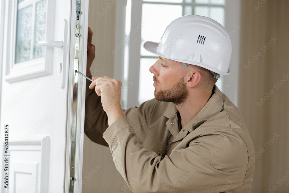 male builder working with door male builder working with door