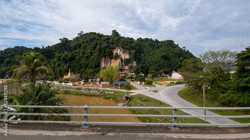Perak, Malaysia - Aug 7, 2022 : A roadside Chinese temple in the middle of Tapah town. View from the car.