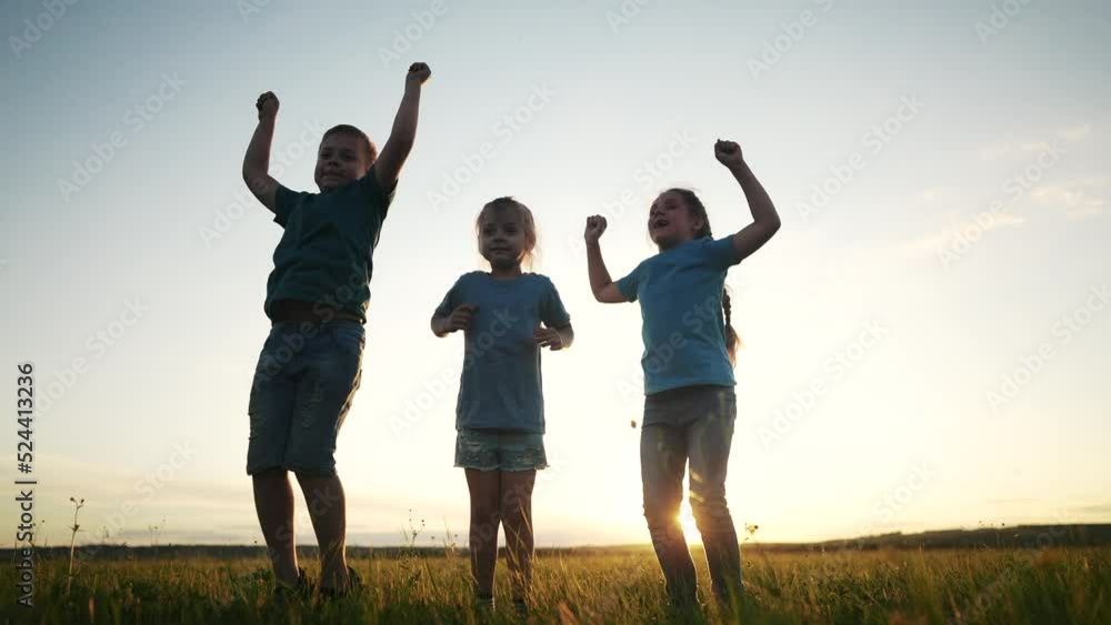 happy kid child a jump. group team of children jump silhouette in the park at sunset rejoice in victory. happy family kid dream concept. freedom happiness childhood concept. children lifestyle jump happy kid child a jump. group team of children jump silhouette in the park at sunset rejoice in victory. happy family kid dream concept. freedom happiness childhood concept. children lifestyle jump