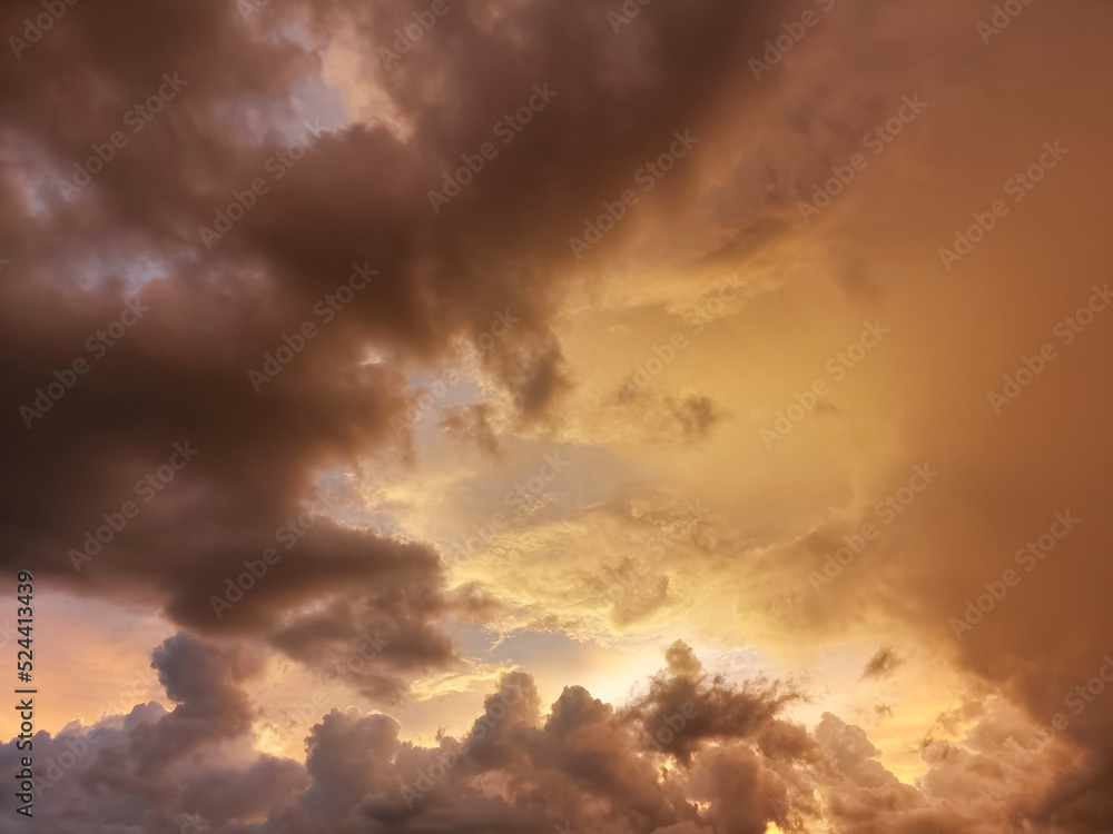 Beautiful sky with clouds in the golden light of the sun.