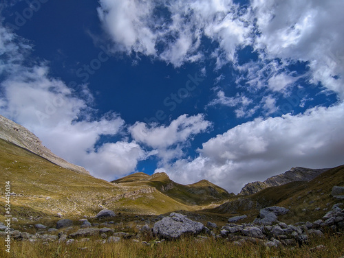 Summer view of Val Chiarino with blue sky and clouds in Abruzzo Italy