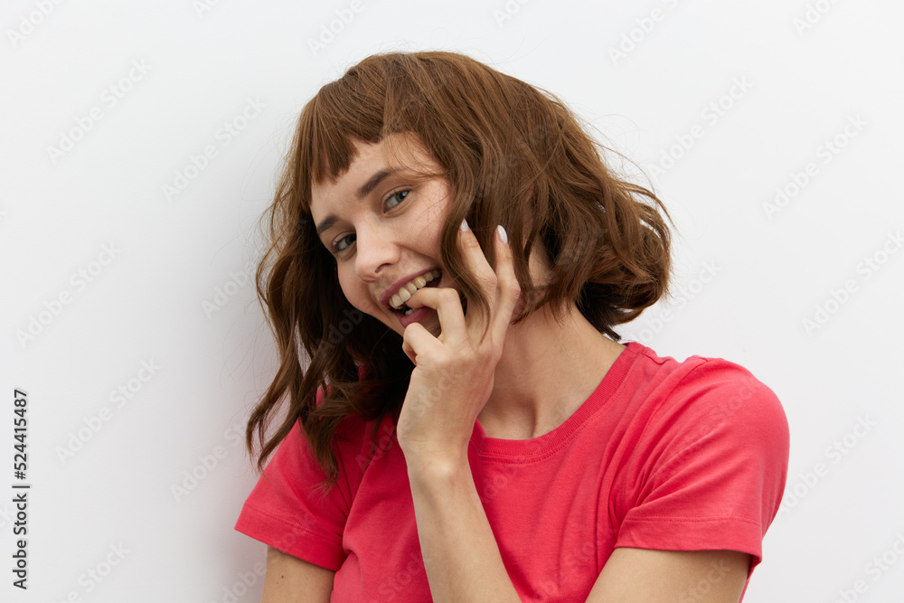 a close portrait of a happy, beautiful, attractive red-haired woman playfully hiding her face behind her hair a close portrait of a happy, beautiful, attractive red-haired woman playfully hiding her face behind her hair