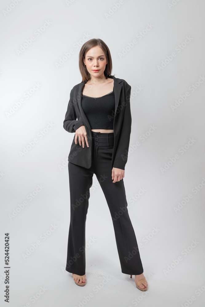 Full length body portrait of a young beautiful asian female businesswoman wearing full black business attire and pose with different gestures & emotions. Suitable for business presentation or slides. Full length body portrait of a young beautiful asian female businesswoman wearing full black business attire and pose with different gestures & emotions. Suitable for business presentation or slides.