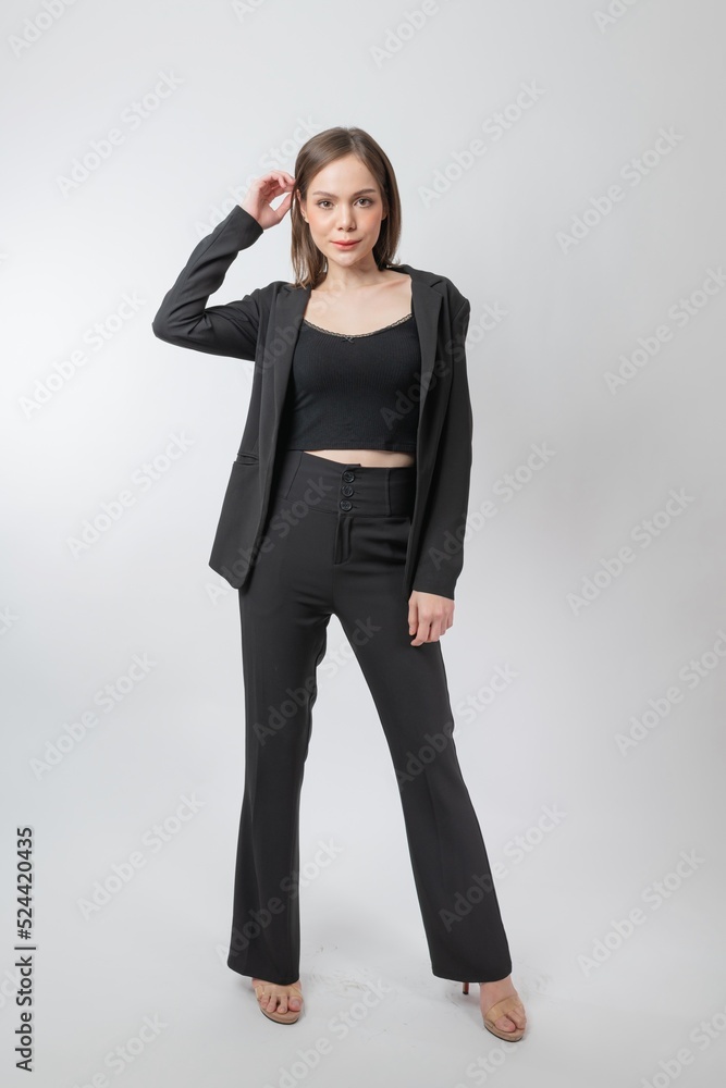 Full length body portrait of a young beautiful asian female businesswoman wearing full black business attire and pose with different gestures & emotions. Suitable for business presentation or slides. Full length body portrait of a young beautiful asian female businesswoman wearing full black business attire and pose with different gestures & emotions. Suitable for business presentation or slides.