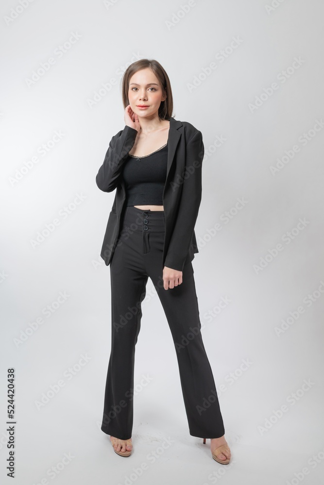 Full length body portrait of a young beautiful asian female businesswoman wearing full black business attire and pose with different gestures & emotions. Suitable for business presentation or slides. Full length body portrait of a young beautiful asian female businesswoman wearing full black business attire and pose with different gestures & emotions. Suitable for business presentation or slides.