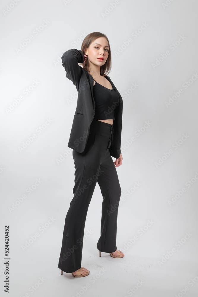 Full length body portrait of a young beautiful asian female businesswoman wearing full black business attire and pose with different gestures & emotions. Suitable for business presentation or slides. Full length body portrait of a young beautiful asian female businesswoman wearing full black business attire and pose with different gestures & emotions. Suitable for business presentation or slides.