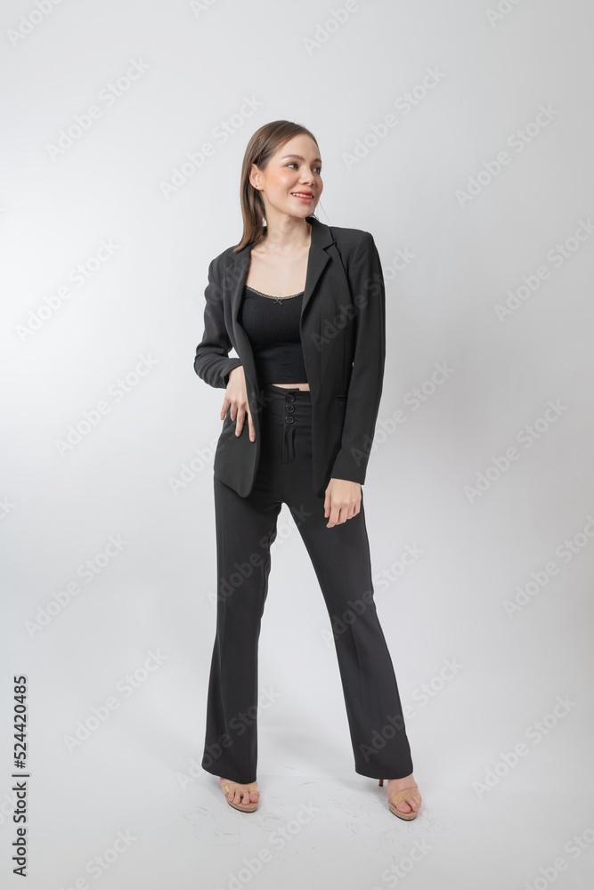Full length body portrait of a young beautiful asian female businesswoman wearing full black business attire and pose with different gestures & emotions. Suitable for business presentation or slides. Full length body portrait of a young beautiful asian female businesswoman wearing full black business attire and pose with different gestures & emotions. Suitable for business presentation or slides.