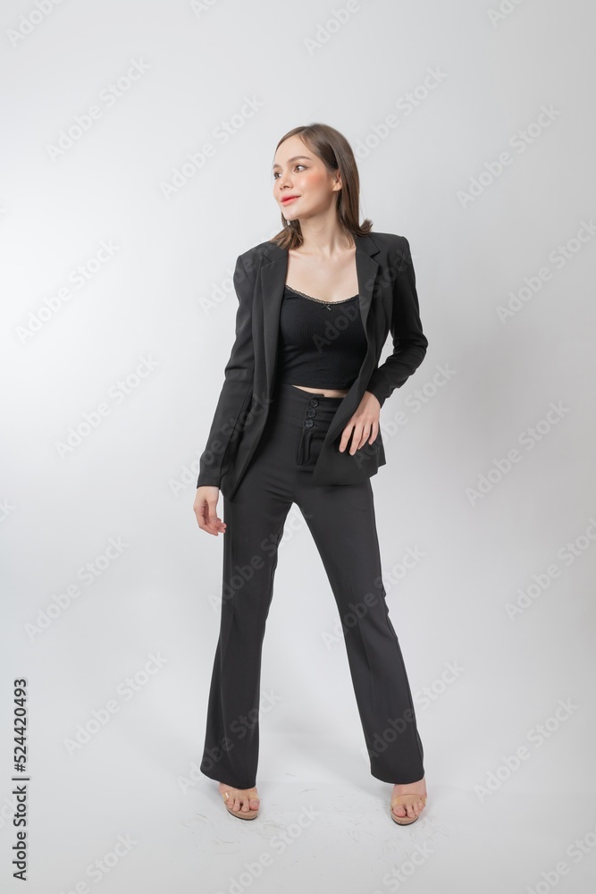 Full length body portrait of a young beautiful asian female businesswoman wearing full black business attire and pose with different gestures & emotions. Suitable for business presentation or slides. Full length body portrait of a young beautiful asian female businesswoman wearing full black business attire and pose with different gestures & emotions. Suitable for business presentation or slides.