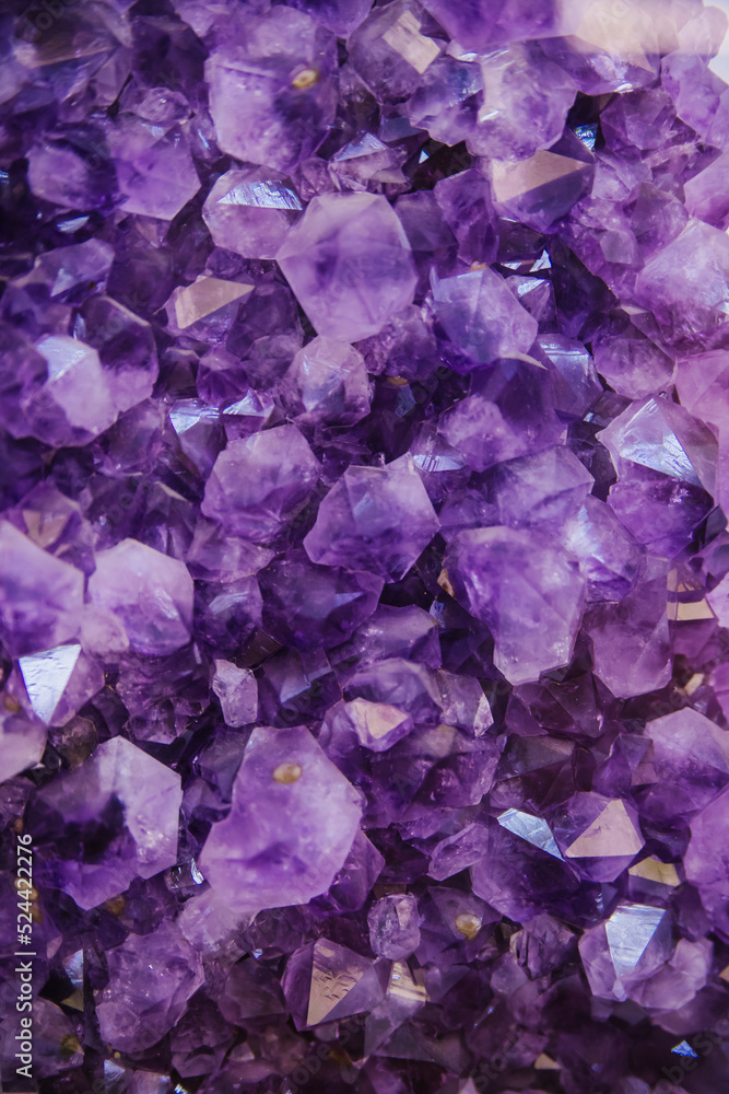 Close-up of a large purple amethyst crystal cluster.Purple Crystal. Purple rough amethyst, quartz crystals. Close-up of a large purple amethyst crystal cluster.Purple Crystal. Purple rough amethyst, quartz crystals.