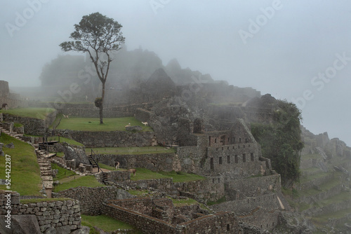 Machu Picchu ancient city view from Huchu'y Picchu in cloudy weather photo