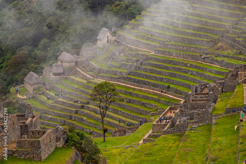 Machu Picchu ancient city view from Huchu'y Picchu in cloudy weather photo