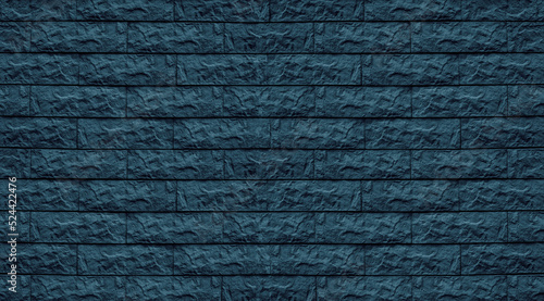 Petrol blue color stone block tile masonry texture. Rough brick wall dark background