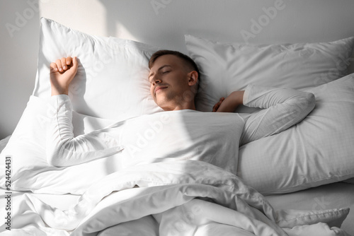 Handsome young man sleeping...