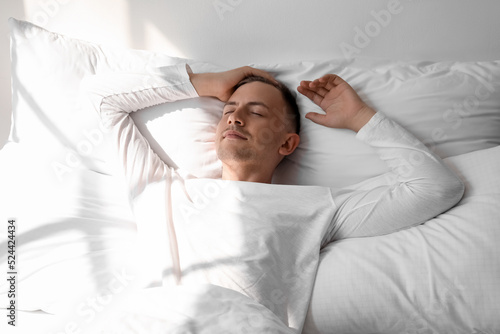 Handsome young man sleeping...