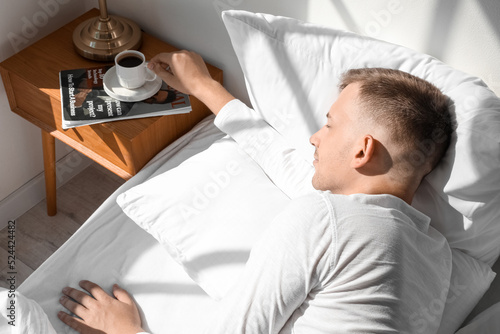 Handsome young man taking c...