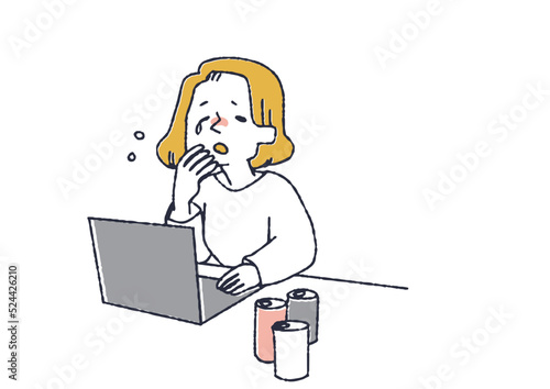 仕事中あくびをしているビジネスウーマン　カフェインの取り過ぎによる睡眠不足を疑われる人々