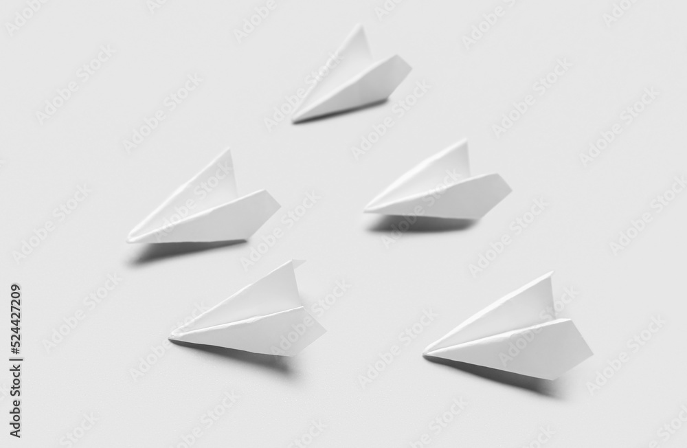 Paper planes on grey background Paper planes on grey background