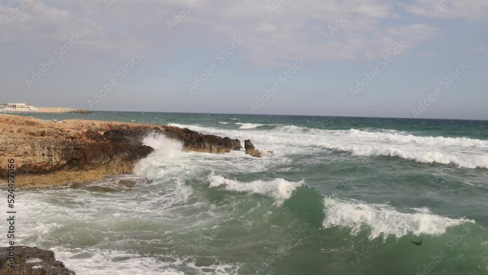 The waves of the sea crash against the rocky coast. The waves of the sea crash against the rocky coast.